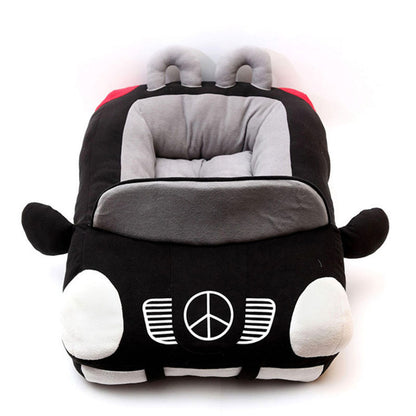 A car-shaped pet toy with a black and gray interior and white cotton exterior, featuring a peace sign on the front.