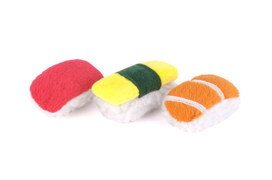 Three colorful sushi-shaped toys on a white background