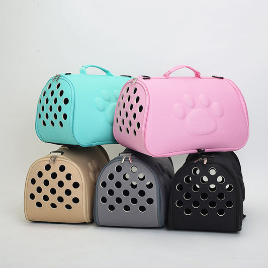 A collection of Footprint folding pet carriers in various colors including green, black, brown, gray, and pink, designed for small pets like cats and dogs.